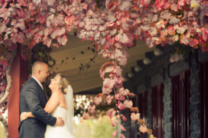Happy Couple embrace under tree at St Anne's Winery