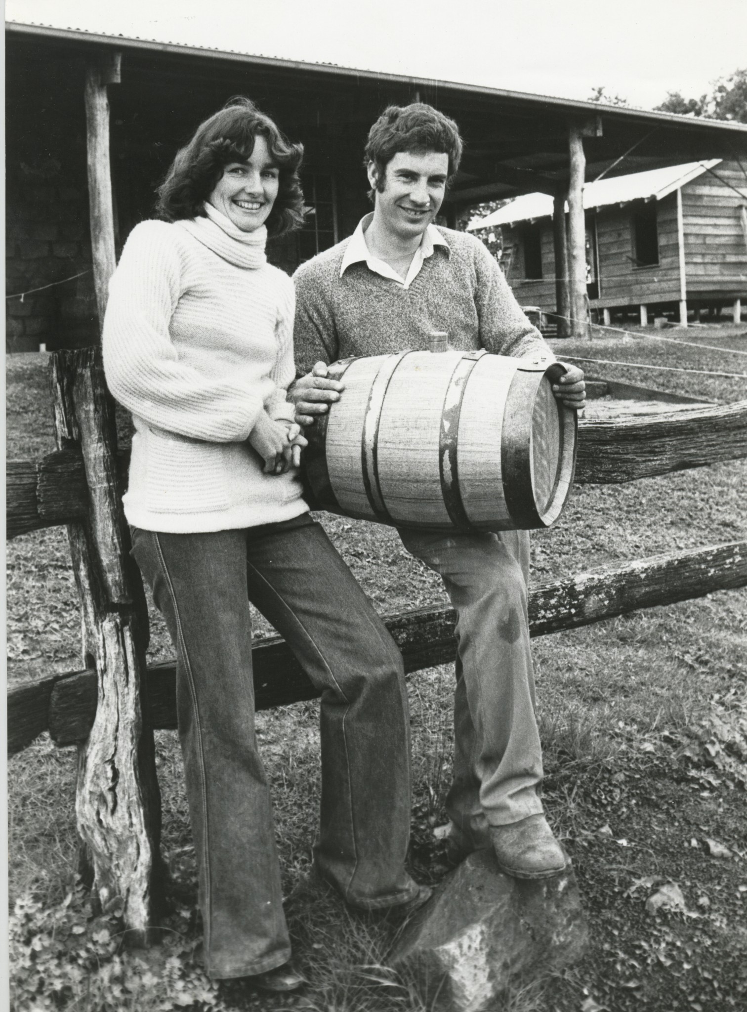 Old Photo of Couple holding barrel of wine